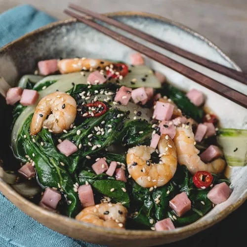 Cold salad of sauteed chard with cubed ham and prawns